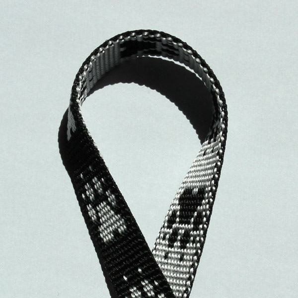 polypropylénový popruh, strieborná farba s motívom stôp, šírka 15 mm